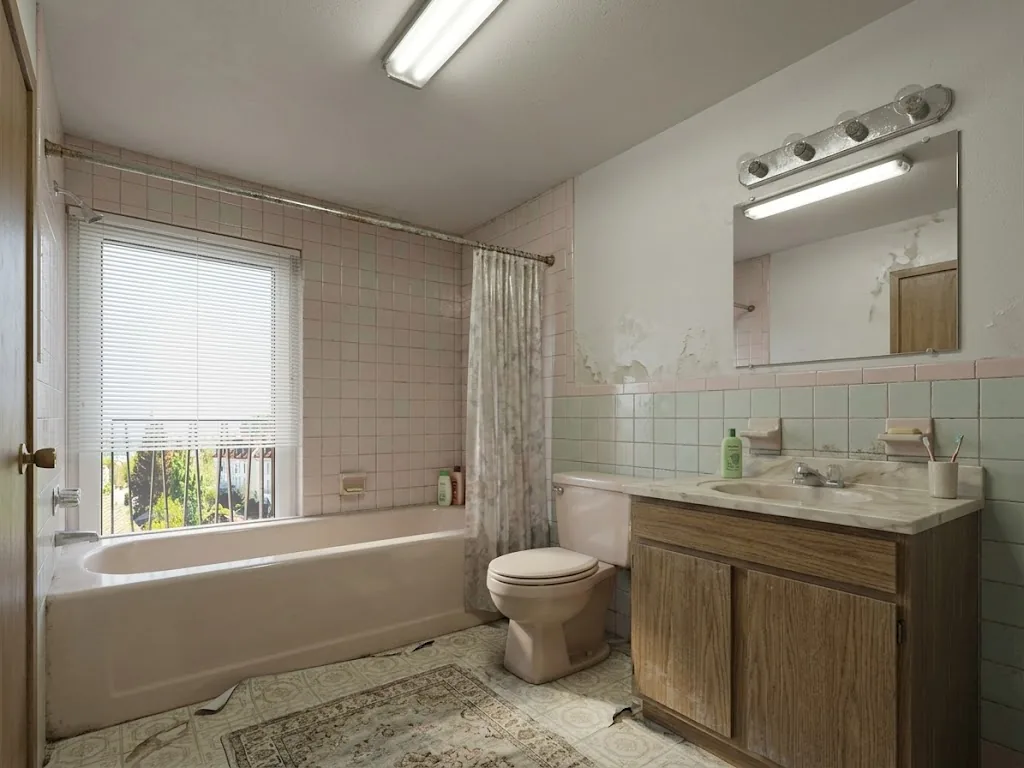 Original bathroom with pink and mint tile